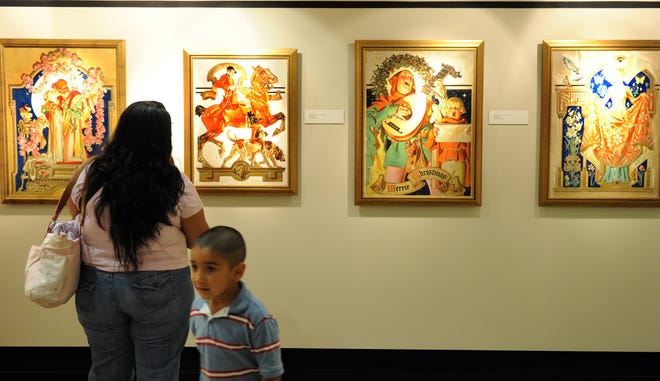 Jeanette Silva and her son, Francisco Silva, of Stockton visit the J. C. Leyendecker exhibit July 18, 2010, at The 
Haggin Museum in Stockton.