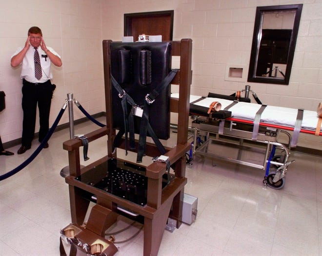 FILE - In this Oct. 13, 1999, file photo, Ricky Bell, warden at Riverbend Maximum Security Institution in Nashville, Tenn., gives a tour of the prison's execution chamber(AP Photo/Mark Humphrey, File)