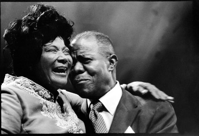 Mahalia Jackson and Louis Armstrong share an emotional moment on stage at the Newport Jazz Festival in 1970. The festival that year featured a tribute to Armstrong.