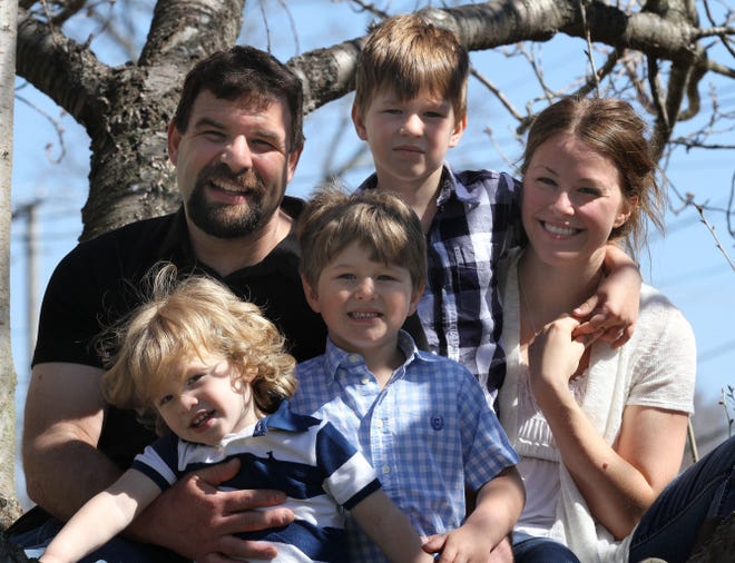 The Maziarz family - Joshua, Danielle and sons, from left, Charlie, Jack and Cade - in their Cumberland home in April.