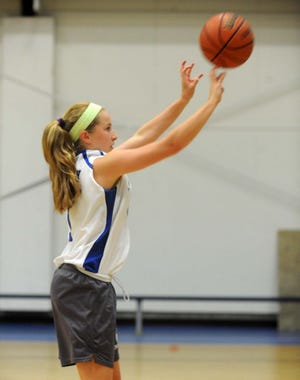 Kelly Fogarty, 15, of Walpole High School takes a shot during Saturday's A Shot for Life Challenge.
