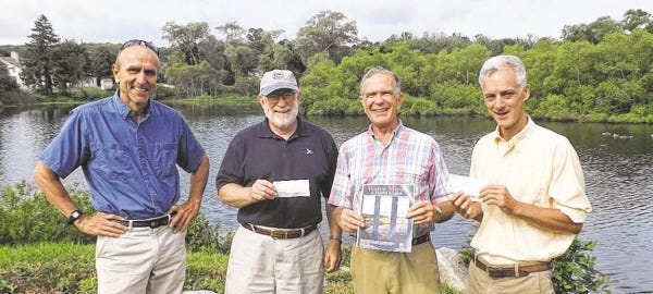 Courtesy photo
Greater Tiverton Community Chorus donated concert proceeds to aid the missions of Westport River Watershed Alliance and the Nature Conservancy of Rhode Island. From left to right are Curt Freese, interim executive of Westport River Watershed Alliance; Tom Schmitt, president, WRWA; outgoing chorus president Buzz Brownlee; and John Berg, Sakonnet landscape manager of the Nature Conservancy of Rhode Island.