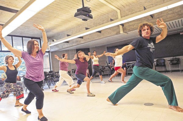 PHOTO BY MICHAEL SMITH/HATHAWAY NEWS SERVICE
UMass Dartmouth alum Gregory Dillon instructs students in the art of capoeira, a Brazilian dance.