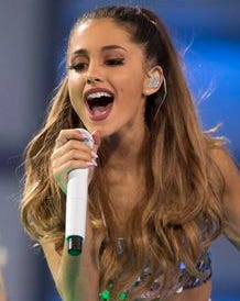 FILE - In this June 15, 2014 file photo, Ariana Grande performs at the 2014 Much Music Video Awards in Toronto. Grande will sing the national anthem at CenturyLink Field in Seattle on Sept. 4, 2014, before the Seattle Seahawks play the Green Bay Packers in an NFL football game, as the NFL kicks off its 95th season. (AP Photo/The Canadian Press, Chris Young, File)