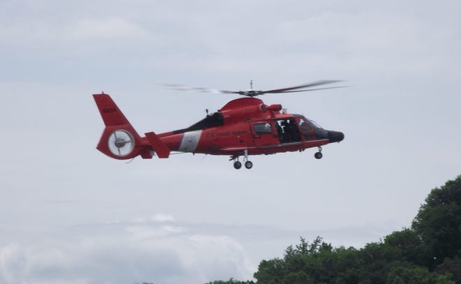 The U.S. Coast Guard rescue helicopter over Lake Macatawa in Holland on June 1, 2013. Jim Hayden/Sentinel staff