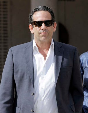 Anthony Bosch, former owner of the Biogenesis of America clinic, leaves the federal courthouse in Miami after paying bond on Tuesday, Aug. 5, 2014. Bosch was charged with conspiracy to distribute steroids. The former clinic owner accused of selling performance-enhancing drugs to Alex Rodriguez has agreed to plead guilty in what prosecutors called a wide-ranging conspiracy to distribute steroids to both major league ballplayers and high school athletes. (AP Photo/Alan Diaz)