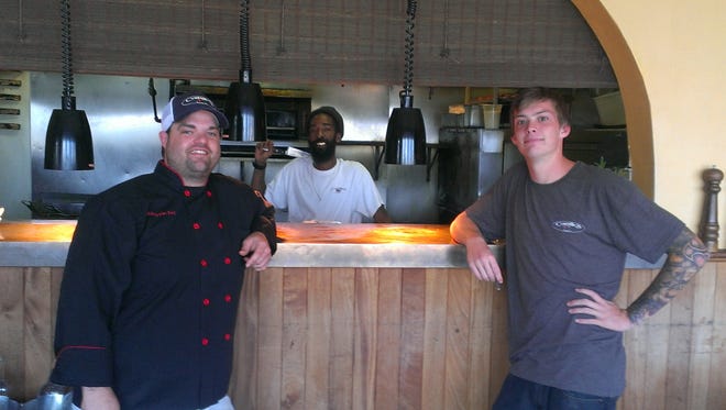 Chef Blake Van Zant (left) with his crew at Camille’s at Crystal Beach.