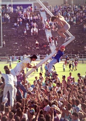 Fans celebrate the end of a 30-game winless streak in Bill Snyder's first win on Sept. 23, 1989.