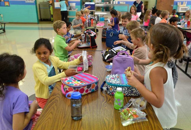 A group of students mingle with their new classmates during their first day of school at Malcom Bridge Elementary School on Wednesday, Aug. 6, 2014 in Oconee County, Ga.  (Richard Hamm/Staff) OnlineAthens / Athens Banner-Herald