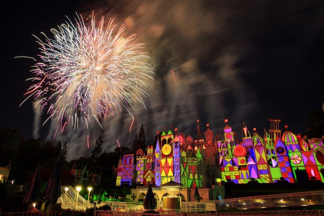 Fireworks light up the sky over the "It's a Small World" ride at Disneyland in Anaheim, Calif., on July 16. The popular attraction has ferried visitors at the Anaheim theme park for 50 years.