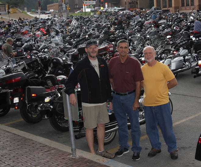 Pictured: Jerry Haas, David Smith and Joe Campbell pose for a photo this week during Sturgis Motorcycle Rally in Sturgis, South Dakota. The three are part of a team from Prince Avenue Baptist Church that traveled to the rally to share the gospel of Jesus Christ with the thousands of people who attend the week long motorcycle rally each year.  Picture taken by team member Robert Adams.