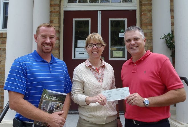 From left: Kevin Kromko, WAMS Administrative Intern; Sally Corrigan, Executive Director Pike County Conservation District presenting check to William Theobold, Assistant Principal WAMS.
contributed