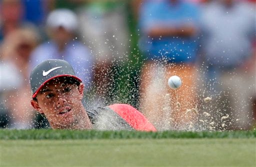 Rory McIlroy, of Northern Ireland, watches shot out of the bunker on the sixth hole during the first round of the PGA Championship golf tournament at Valhalla Golf Club on Thursday, Aug. 7, 2014, in Louisville, Ky. (AP Photo/Mike Groll)
