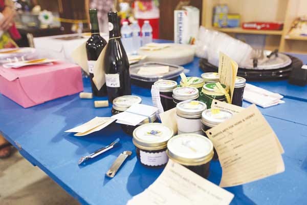 Photo by Ashley Schreyer/New Jersey Herald Blueberry wines and preserves await the judges of the One and Only Blueberry Contest at the New Jersey State Fair/Sussex County Farm and Horse Show on Wednesday.