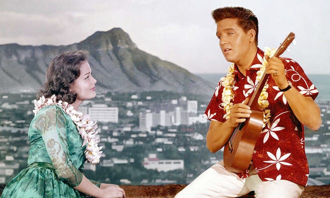 Chad Gates (Elvis Presley), right, serenades his girlfriend Maile Duval (Joan Blackman) in a scene from "Blue Hawaii," the 1961 romantic musical comedy the Kansas Museum of History will show after dusk Friday as part of its Sundown Film Festival outdoors on the museum grounds, 6425 S.W. 6th. Admission is free.