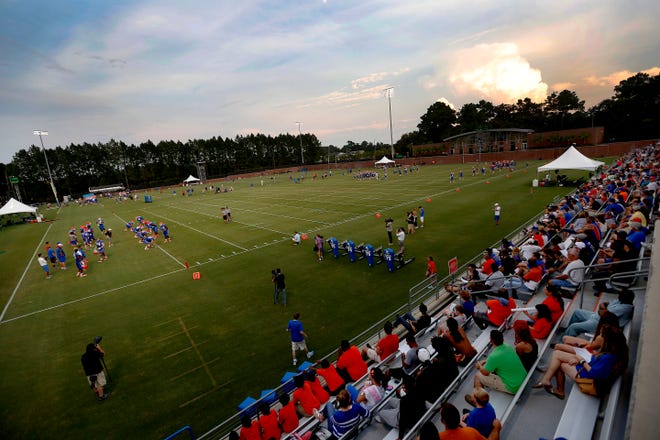 Fans watch the Florida Gators during practice on Thursday in Gainesville