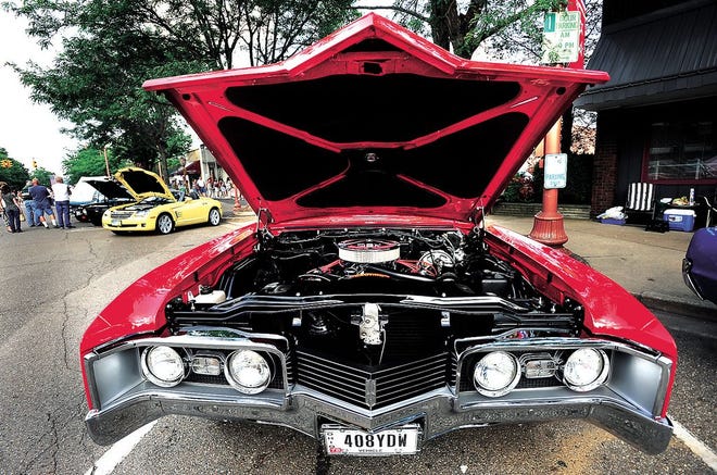 A view under the hood of a 1967 Oldsmobile Delta 88 owned by Mark Cutshall of Canton on display at the Downtown Dover Car & Motorcycle Show last Friday.