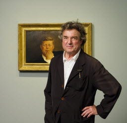 A 100-piece exhibit at the Museum of Fine Arts in Boston celebrates the career of painter Jamie Wyeth, shown here this summer with his “Portrait of John F. Kennedy.”