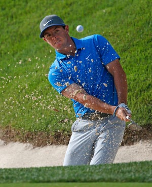 Rory McIlroy hits out of the bunker on the 14th hole during the third round of the PGA Championship golf tournament at Valhalla Golf Club on Saturday in Louisville, Ky. (AP Photo/Mike Groll)