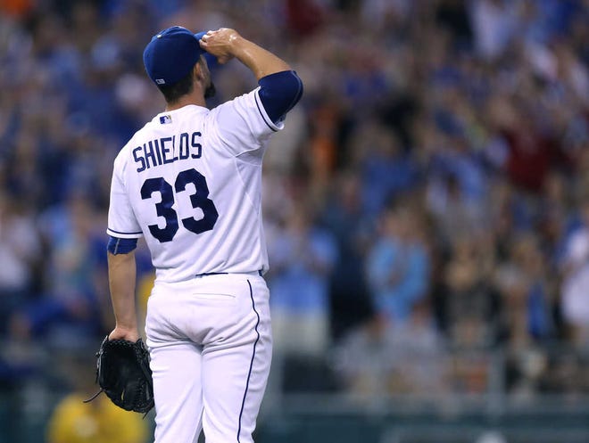 Kansas City Royals starting pitcher James Shields salutes after San Francisco Giants' Pablo Sandoval made the last out to end a baseball game Saturday, Aug. 9, 2014, in Kansas City, Mo. Shields threw a four-hitter as the Royals won 5-0.