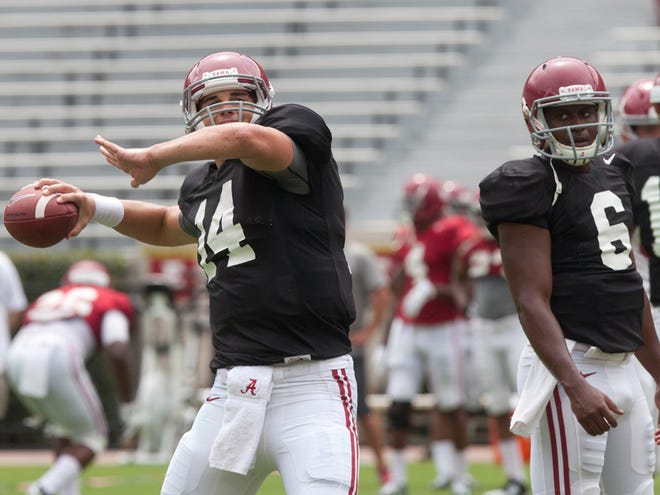 A heavy rainstorm Saturday made for difficult throwing conditions for Alabama quarterbacks in Saturday’s scrimmage. Alabama coach Nick Saban said Blake Sims (right) and Jake Coker (left) “both guys showed that they’re capable of doing what we need to do with them on offense so that we can be effective with the other players that we have.”