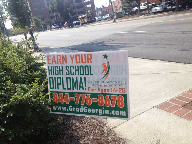 A sign on Reynolds Street advertising Graduation Achievement Centers of Georgia are violations of the city's code.