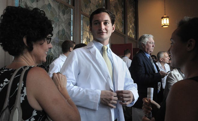 Jarrett Shugars of Doylestown is one of 232 students to receive their white coats Friday in a ceremony marking their starting of medical school at the Temple Performing Arts Center in Philadlelphia.