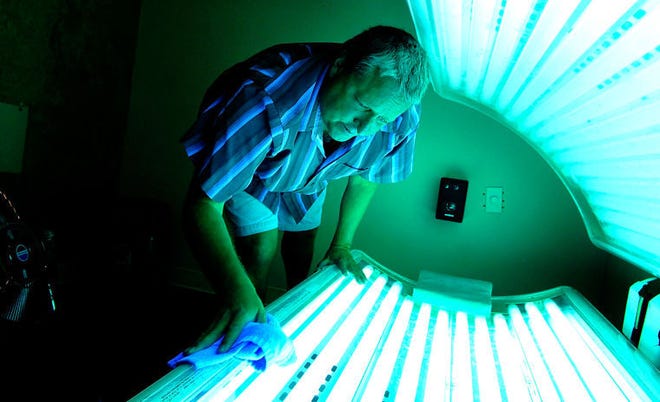 New state regulations, which took effect last month, limit indoor tanning bed use to those over age 16 and require 17-year-olds to get parental consent.