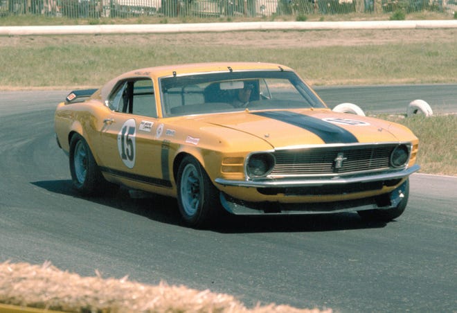 Limited-edition Mustangs by designers such as Carroll Shelby and former NASCAR car owner Bud Moore helped set the cars apart. Here, race driver Parnelli Jones drives his Bud Moore-prepared 1970 Mustang Boss 302.