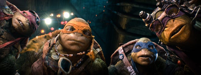 From left, Raphael, Michelangelo, Leonardo and Donatello appear in a scene from "Teenage Mutant Ninja Turtles," the weekend's top earner at the box office with a haul of $65 million.

AP Photo/ Paramount Pictures, Industrial Light & Magic