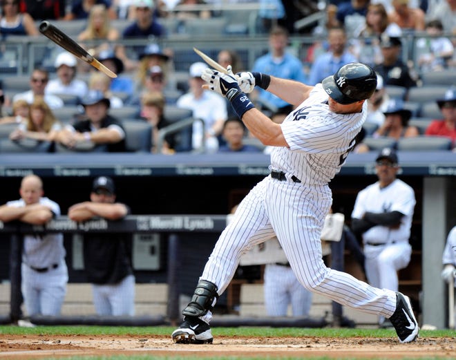 New York's Mark Teixeira breaks his bat Sunday during the first inning of a game against the Cleveland Indians at Yankee Stadium in New York. The Yankees lost, 4-1. THE ASSOCIATED PRESS