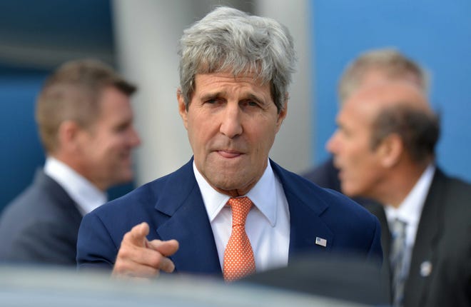 U.S. Secretary of State John Kerry points a finger as he arrives in Sydney, Monday, Aug. 11, 2014. Kerry and US Secretary of Defense Chuck Hagel are in Sydney for the annual Australia-United States Ministerial (AUSMIN) talks.