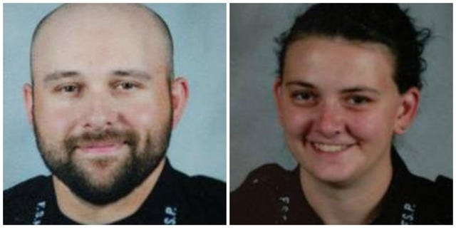 Fort Smith police officers Angus Bradford, left, and Lindsay Herring
