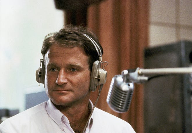 FILE - This 1987 file photo released by Touchstone Pictures shows actor Robin Williams in character as disc-jockey Adrian Cronauer in director Barry Levinsons comedy drama, "Good Morning Vietnam." Williams, whose free-form comedy and adept impressions dazzled audiences for decades, has died in an apparent suicide. He was 63. The Marin County Sheriff's Office said Williams was pronounced dead at his home in California on Monday, Aug. 11, 2014. The sheriff's office said a preliminary investigation showed the cause of death to be a suicide due to asphyxia.