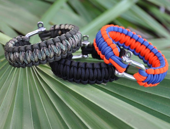The Survival Strap is a practical bracelet for men made of 16 to 24 feet of patterned paracord to use in emergency situations.