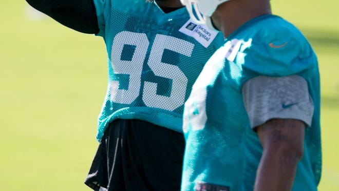 Miami Dolphins defensive end Dion Jordan (95) at Dolphins training camp in Davie, Florida on July 25, 2014. (Allen Eyestone / The Palm Beach Post)