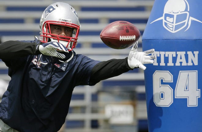 Patriots cornerback Darrelle Revis reachesd for a pass during Tuesday's practice session at Gillette Stadium.