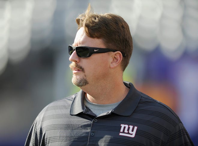 Giants offensive coordinator Ben McAdoo watches the Giants warm up before a preseason game Sunday in East Rutherford, N.J. The Associated Press.