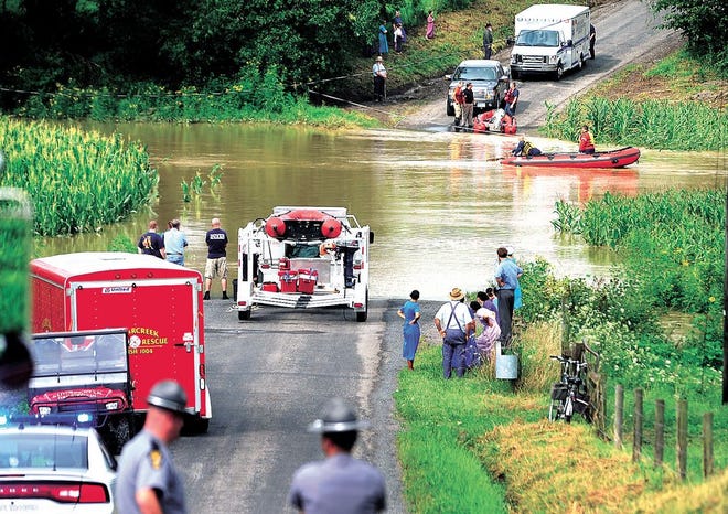 Sugarcreek and Dover firefighters rescued a man after his truck was swept off of Maple Drive in Sugarcreek after the area flooded Tuesday.