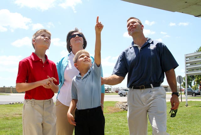 Rachel Rodemann • Times Record / Senior Master Sgt. Scott Barr and his wife, Cindy Barr show their sons, Andrew, 7, and Isaac, 12, parts on a retired A-10 Thunderbolt II "Warthog" Tuesday, Aug. 12, 2014, at the 188th Air National Guard in Fort Smith. The Barr family was chosen as Air National Guard Family of the Year this year. 
 Rachel Rodemann • Times Record / Senior Master Sgt. Scott Barr holds his youngest son, Andrew, 7, up to see a part on a retired A-10 Thunderbolt II "Warthog," while his oldest son, Isaac Barr, 12, watches from the ground Tuesday, Aug. 12, 2014, at the 188th Air National Guard in Fort Smith. The Barr family was chosen as Air National Guard Family of the Year this year.
