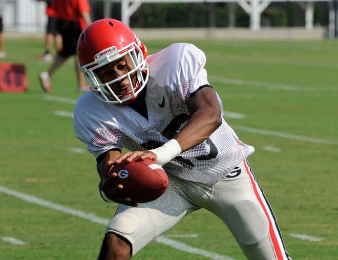 UGA sports communications  Defensive back Aaron Davis catches a pass during Georgia's practice on Aug. 6.