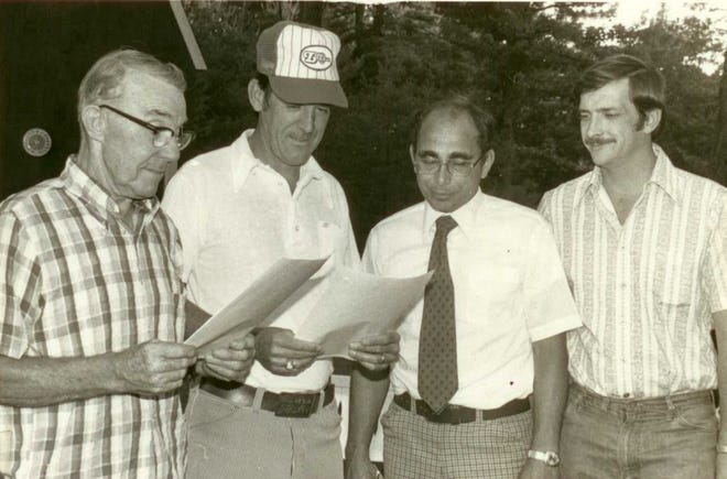 On July 31, 1978, Roger Allen, left, signed a five-year lease for a 400’ x 600’ piece of property on Chestnut Hill Road, which grew into the 96-acre facility that is Roger Allen Ballpark today. From left, next to Roger, were East Side Little League President Al Benton, coach Art Hoover and coach Jack Davis.