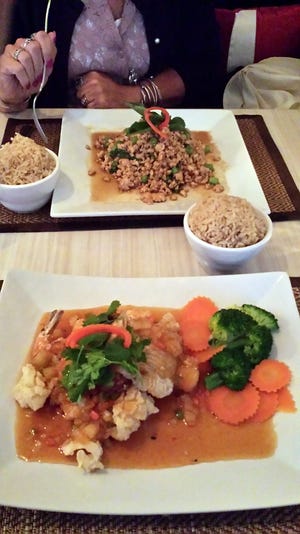 Three-Flavored Seafood, foreground, with Drunken Chicken in the background.