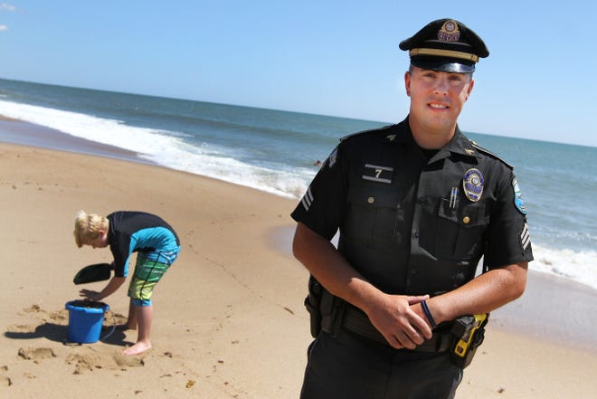 Sgt. Philip Gingerella stands on Thursday in the area of Blue Shutters Beach in Charlestown where he rescued a man caught in a riptide Wednesday.