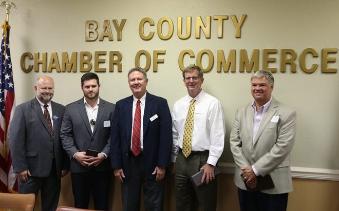 Gulf Coast State College President John Holdnak, from left, Pier Park Mall Manager Michael Husser, Bay County Chamber of Commerce Chairman Larry Carroll, Regional President for Northwest Florida Centennial Bank Jim Haynes and Panama City News Herald Publisher Alan Davis pose for a photo. The Bay County Chamber of Commerce hosted reception for new local CEOs on Thursday.