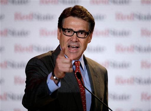 This Aug. 8, 2014, file photo shows Governor Rick Perry as he speaks at the 2014 Red State Gathering, in Fort Worth, Texas. Perry has been indicted for abuse of power after carrying out a threat to veto funding for state public corruption prosecutors. The Republican governor is accused of abusing his official powers by publicly promising to veto $7.5 million for the state public integrity unit at the Travis County District Attorney's office. He was indicted by an Austin grand jury Friday, Aug. 15. (AP Photo/Tony Gutierrez)