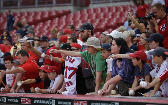 Fans look for autographs from the Red Sox in Cincinnati.