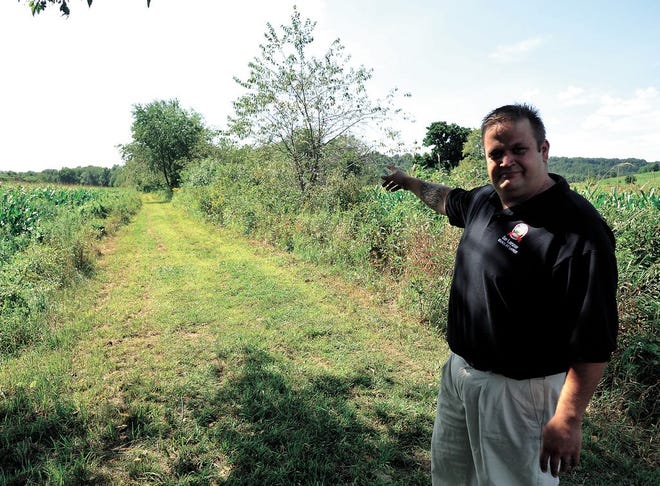 Dan Lanzer, New Philadelphia councilman at large and chairman of the special committee for the trail from New Philadelphia to Roswell, shows the existing trail near Pleasant Valley Road.