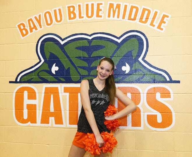 Kaitlynn Williams, 13, poses Wednesday in the gymnasium at Bayou Blue Middle School.