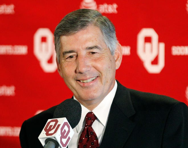Big 12 Commissioner Bob Bowlsby smiles as he answers a question during a news conference in Norman on Aug. 27, 2012. [AP Photo/Sue Ogrocki]